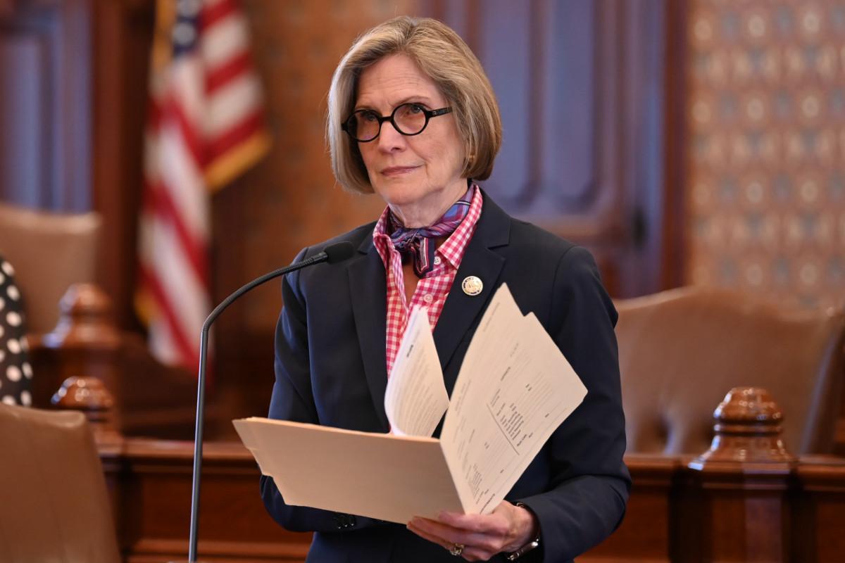 Senator Glowiak Hilton holds a folder while presenting a bill on the Senate floor.